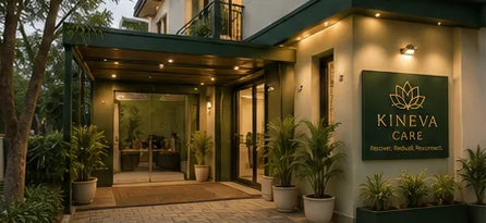 Covered entrance with plants and Kineva Care sign